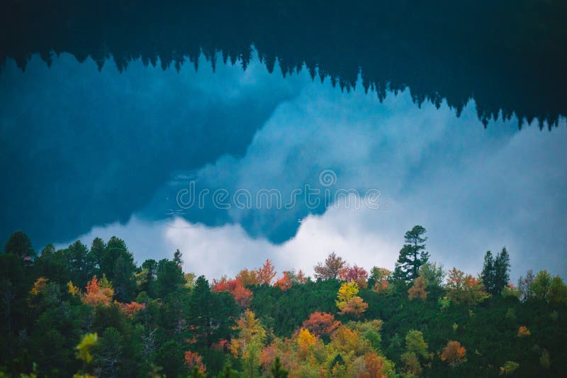 Reflexion in autumn lake. Mountains scenery. Beautiful wallpaper. Mountains reflects in lake. Hiking background