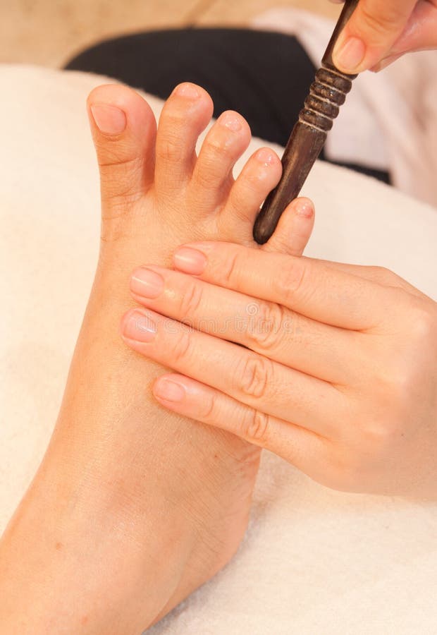 Reflexology Foot Massage by Stick Wood Stock Image Image of blood