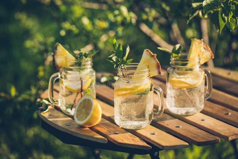 Refreshing chilled lemon water on the garden table.