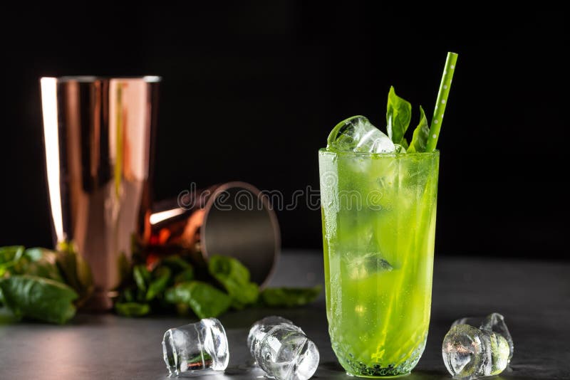 Refreshing and Light Basil Summer Cocktail with Ice Cubes Stock Image
