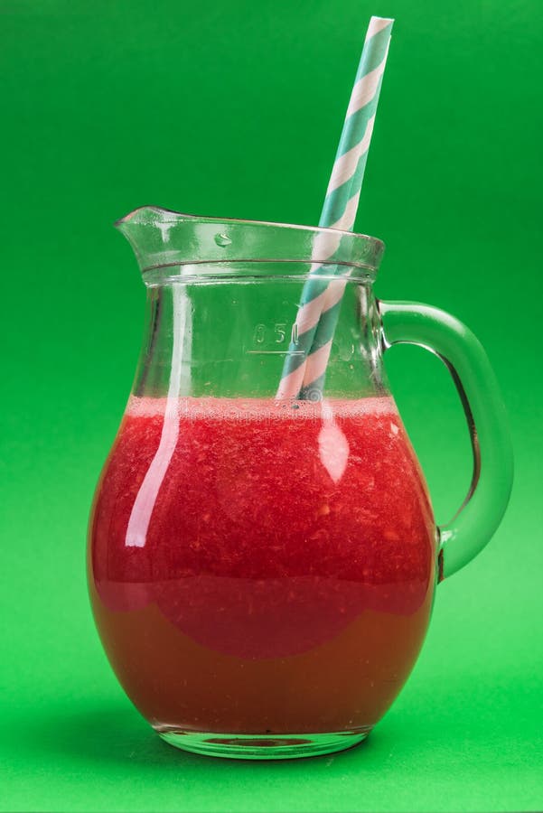 refreshing Watermelon Smoothie or Juice in Glass Jug on Green Background royalty free stock image refreshing Watermelon Smoothie or Juice in Glass Jug on Green Background royalty free stock image