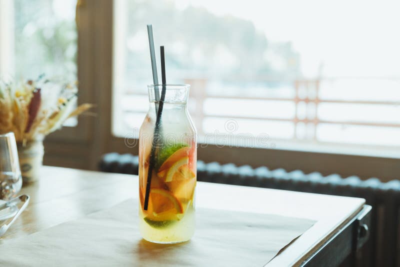Refreshment Summer Drink. Traditional Lemonade with Lemon Mint and Ice on Table.Soft Drinks