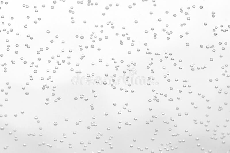 Soda sparkling drink little bubbles with glass transparent white surface background macro. Soda sparkling drink little bubbles with glass transparent white surface background macro.