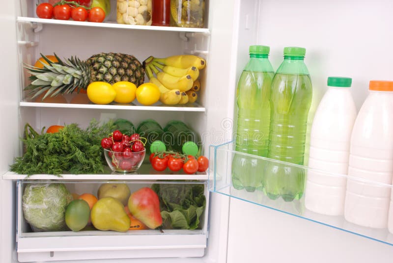 Refrigerator full of food stock photo. Image of bottle 104946326