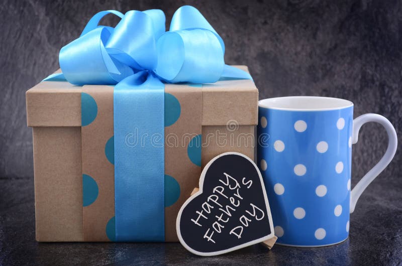 Happy Fathers Day gift on black slate background. Happy Fathers Day gift on black slate background.