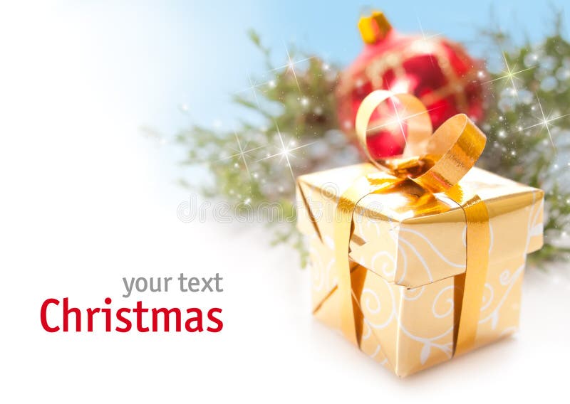 Golden Christmas gift over white background with space for your text. Golden Christmas gift over white background with space for your text