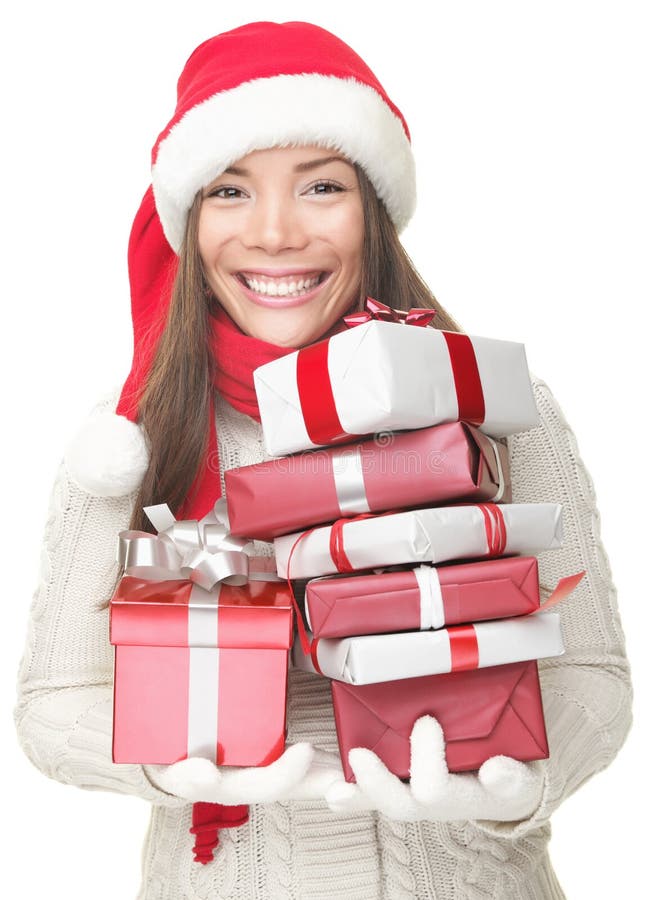 Regalos que llevan de la mujer de la Navidad imágenes de archivo libres de regalías Regalos que llevan de la mujer de la Navidad imágenes de archivo libres de regalías