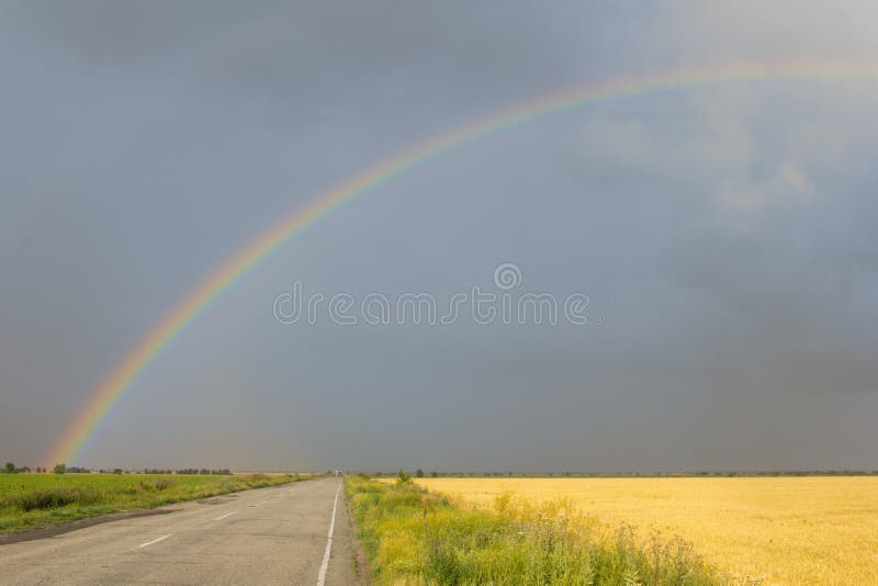 Landscape with country road and rainbow. Landscape with country road and rainbow.