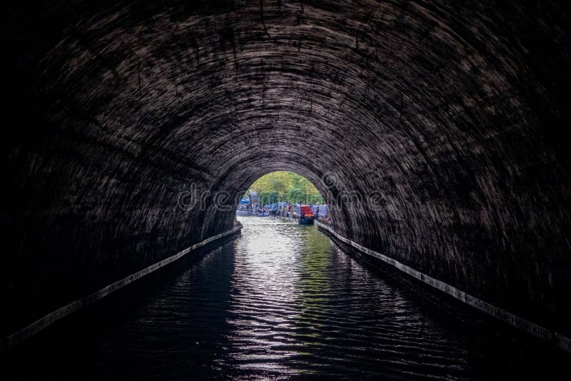 Regent`s Canal, between Regent`s Park and Camden, London UK, photographed on a summer`s day in August 2019 from inside a tunnel. royalty free stock image Regent`s Canal, between Regent`s Park and Camden, London UK, photographed on a summer`s day in August 2019 from inside a tunnel. royalty free stock image