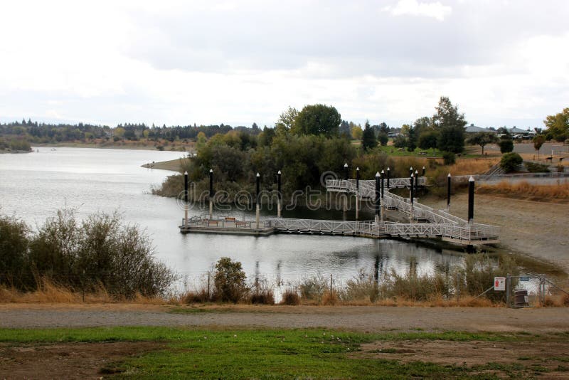 Recreational area of Quarry Lake, Fremont, California with steps leading to dock, facilities for swimming, fishing and boating, with several birds around. Recreational area of Quarry Lake, Fremont, California with steps leading to dock, facilities for swimming, fishing and boating, with several birds around.