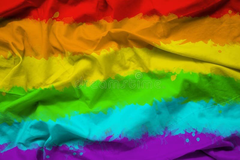 Rainbow flag of LGBTQ for Pride month on fabric texture with ripple. Rainbow flag of LGBTQ for Pride month on fabric texture with ripple.