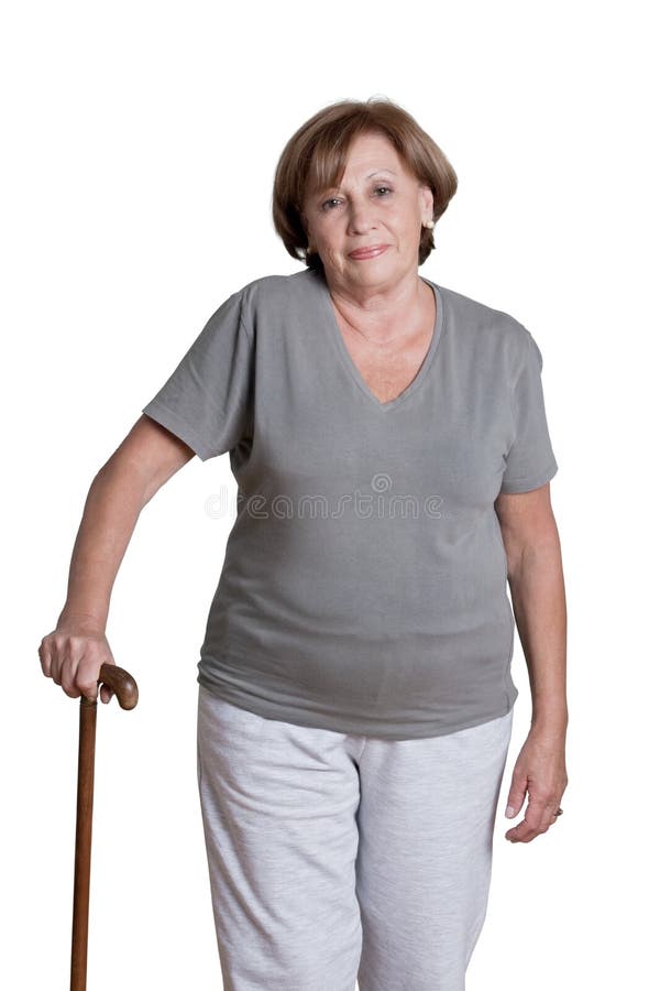 Reife Frau mit Spazierstock stockfotografie