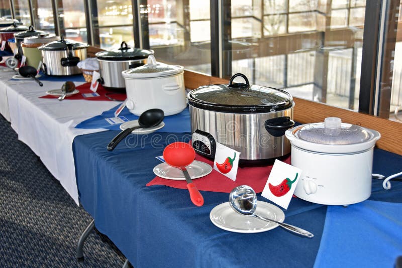 Row of crock pots for chili cook off contest. Row of crock pots for chili cook off contest.