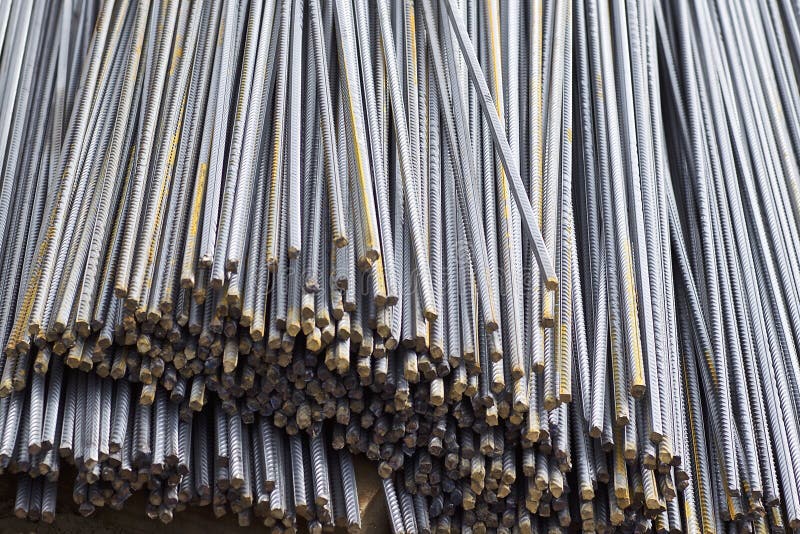 Reinforcing bars with a periodic profile in the packs are stored in the metal products warehouse stock image Reinforcing bars with a periodic profile in the packs are stored in the metal products warehouse stock image