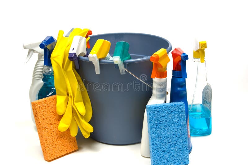 Cleaning supplies on white background including several spray bottles of chemicals, a bucket, gloves and sponges. Cleaning supplies on white background including several spray bottles of chemicals, a bucket, gloves and sponges