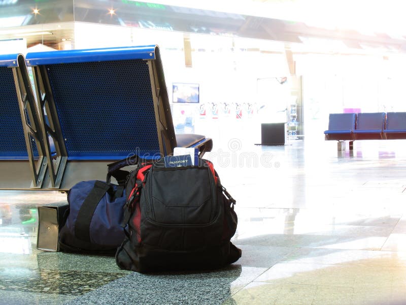 A crisp, clean picture of luggage resting on an airport floor. A crisp, clean picture of luggage resting on an airport floor.
