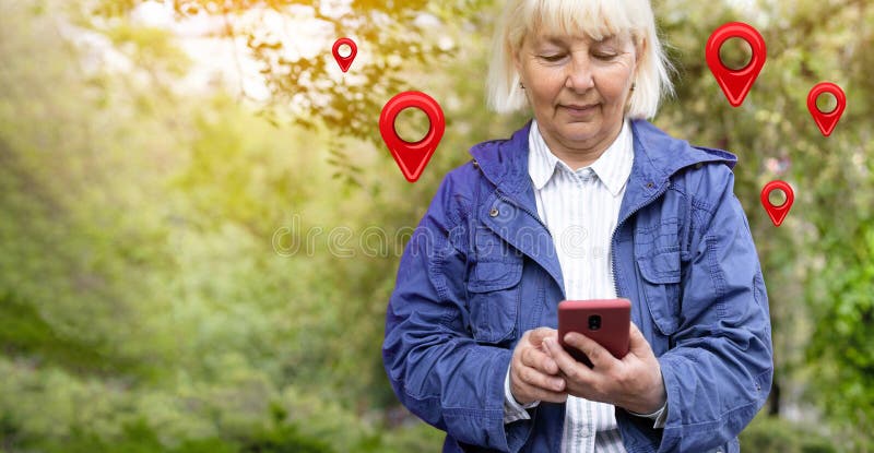 Traveler woman uses map on a mobile phone app to search for route location of place with gps on street when travel in city. Traveler woman uses map on a mobile phone app to search for route location of place with gps on street when travel in city