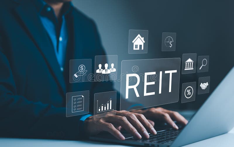 REIT, Real Estate Investment Trust Concept. A businessman works on a laptop with icons representing Real Estate Investment Trust stock image