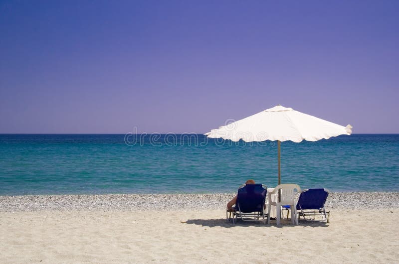 A man relaxing on the beach. A man relaxing on the beach