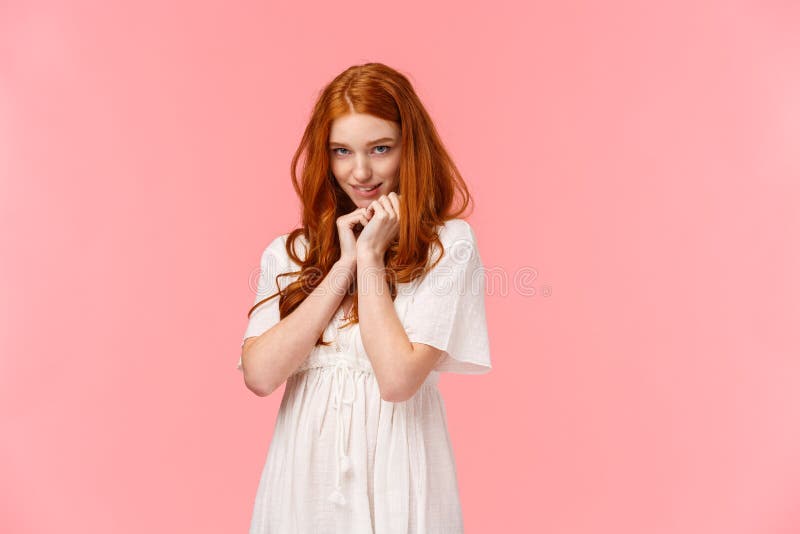 Relationship, seduction and love concept. Cute kawaii young redhead woman in white dress, acting silly and lovely