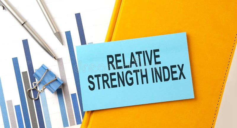 Relative Strength Index text on sticker on the yellow notebook with chart and pen
