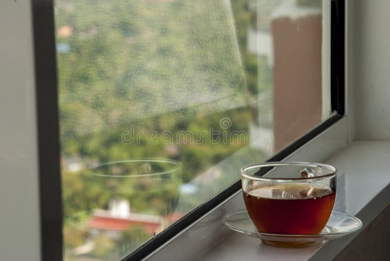 Relax with coffee by the window stock images Relax with coffee by the window stock images