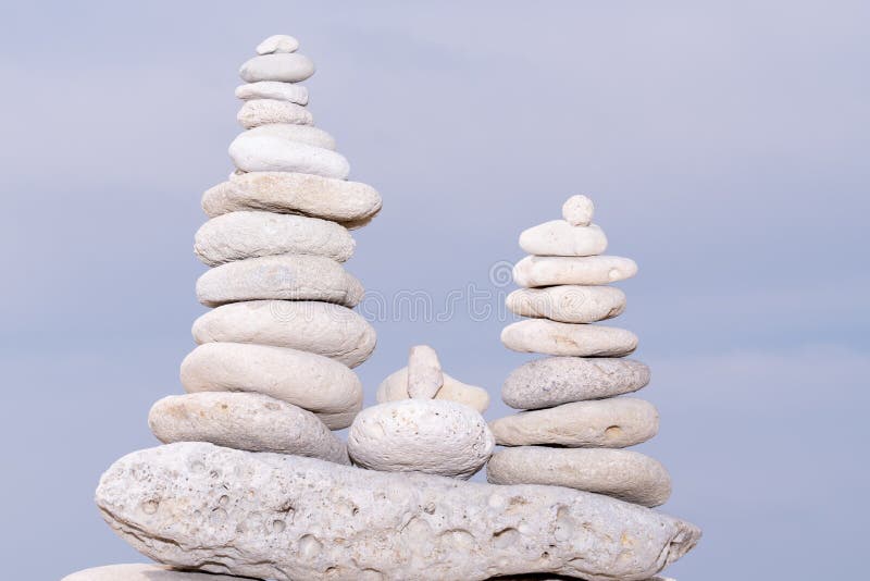 Relax nature concept stack of white pebbles stone against sea background for spa balance meditation and zen theme royalty free stock images Relax nature concept stack of white pebbles stone against sea background for spa balance meditation and zen theme royalty free stock images