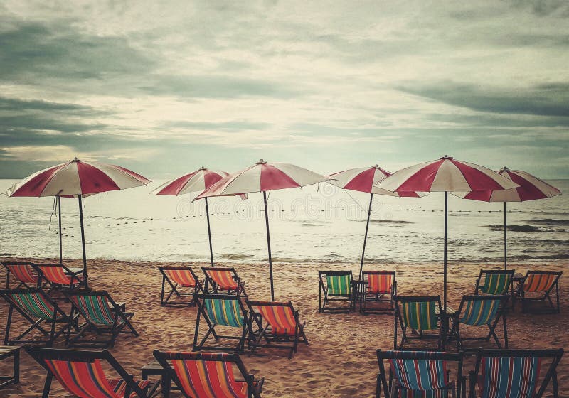 Relaxation on the beach in retro style stock images Relaxation on the beach in retro style stock images