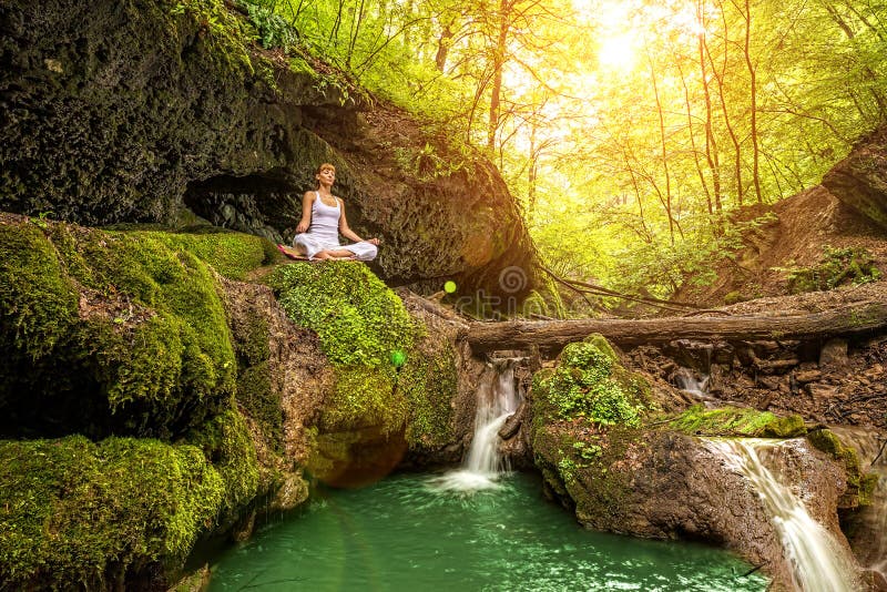Relaxation in Forest at the Waterfall. Ardha Padmasana Pose Stock Image ...