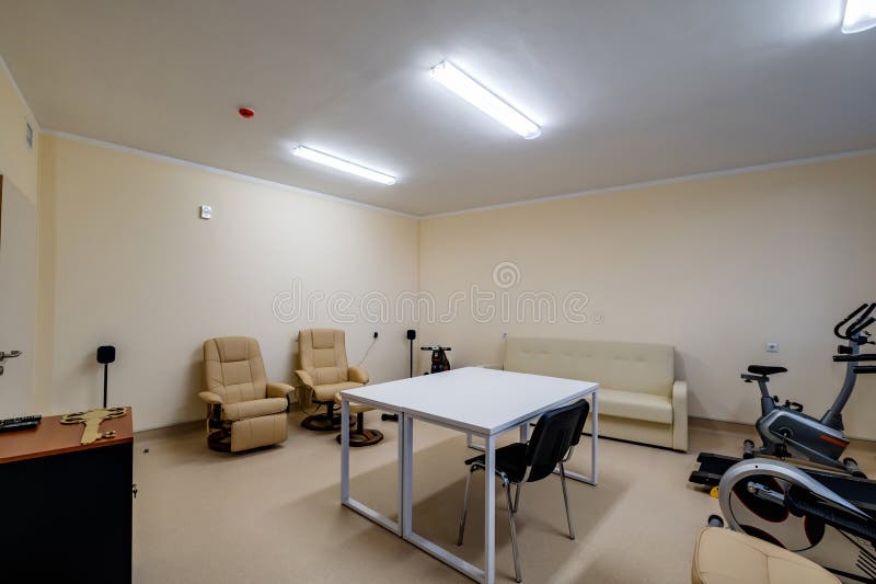 Relaxation Room with Chairs and Exercise Equipment in Office for Rest and Relax of Staff