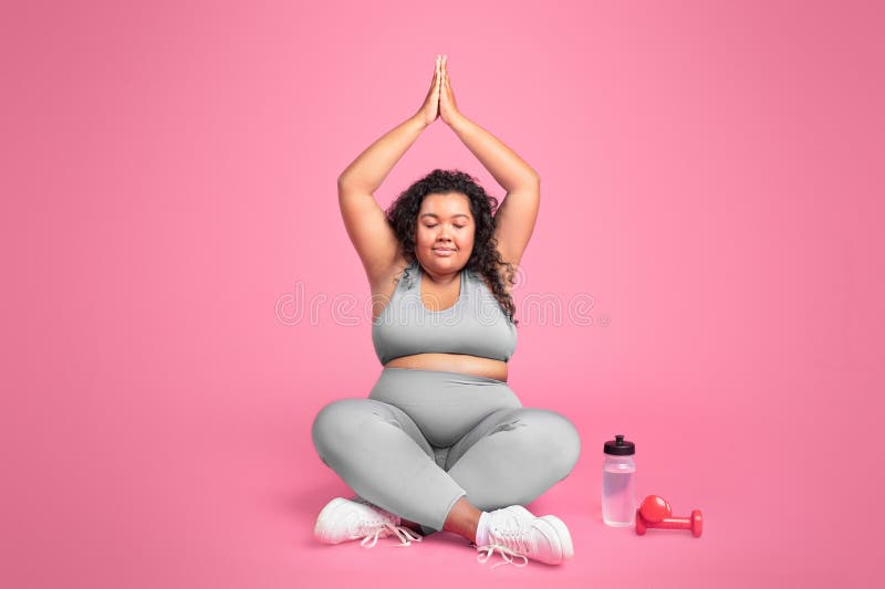 Fat Chubby Female Warms Up Muscles before Yoga or Sport Exercises
