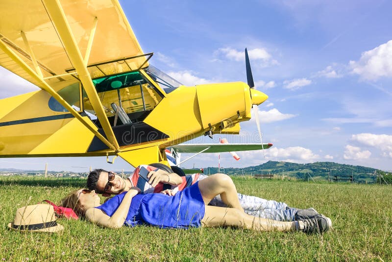 Relaxed couple of lovers having a rest at charter airplane trip