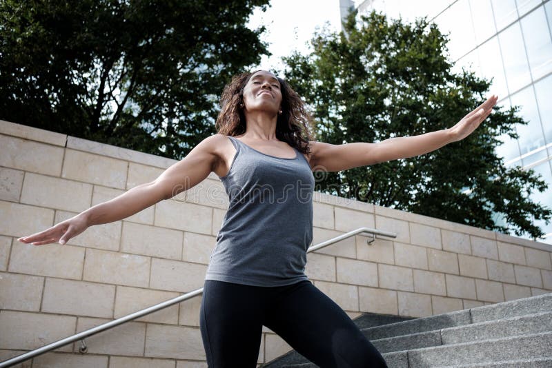 Relaxed Fitness Mature Black Woman Doing Exercise Stock Image