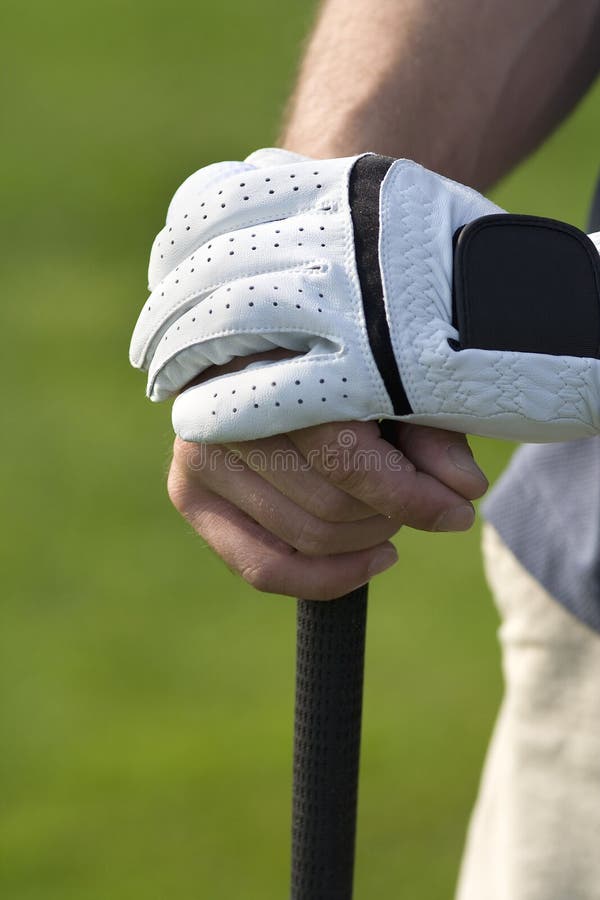 Relaxed hands on golf club - Vertical