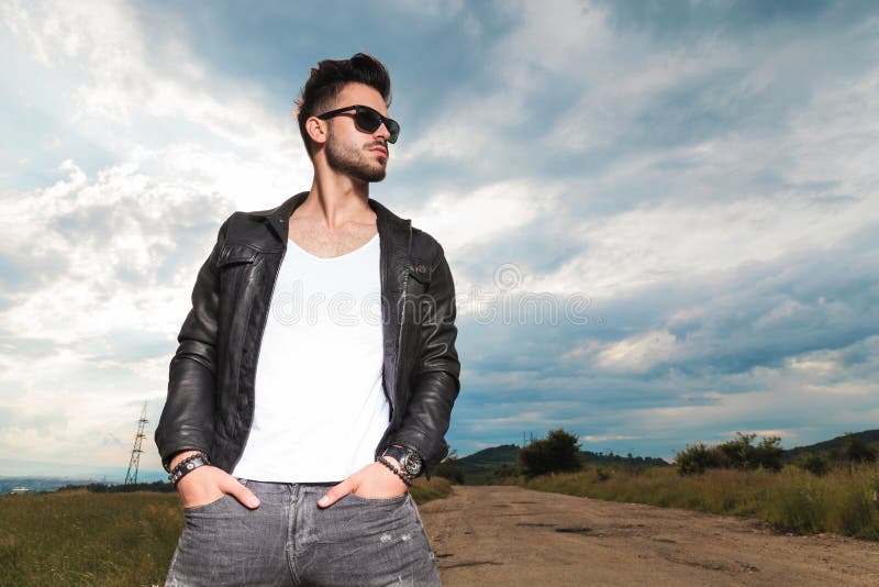 Relaxed Man in Leather Jacket Standing with Hands in Pockets Stock ...