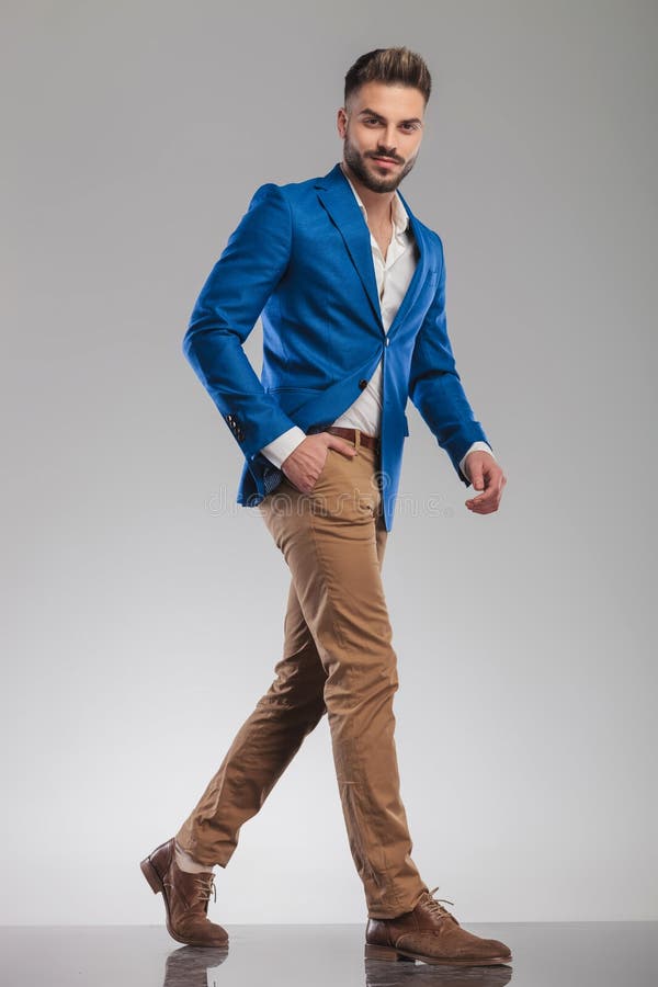 Relaxed Smart Casual Man in Blue Suit Walking To Side Stock Photo ...