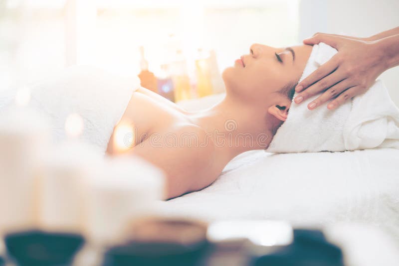 Relaxed Woman Gets Facial And Head Massage In Spa Stock Image Image Of Herbal Center 200190479