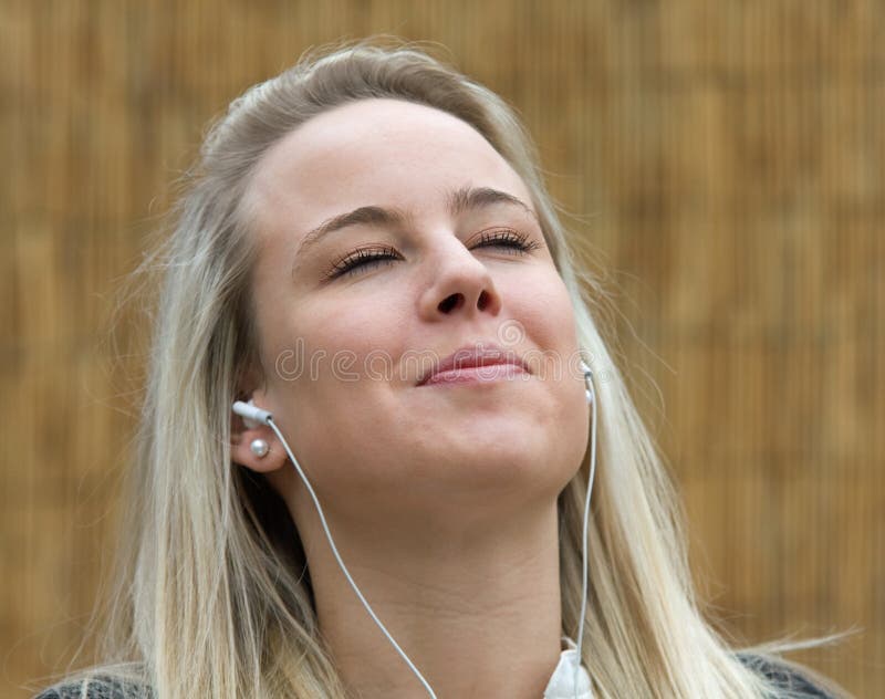 Relaxed woman listening to headphones