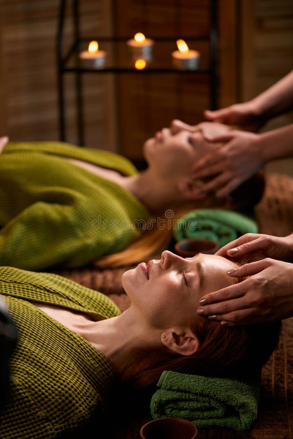 Professional Massage Therapist Gives Head Massage To Two Women Stock Image Image Of Person