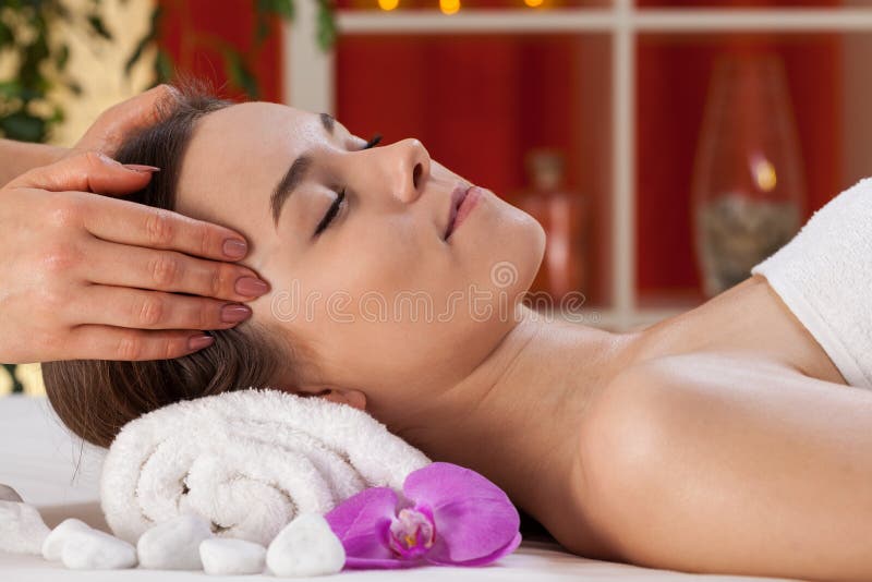 Relaxed woman receiving head massage stock photo Relaxed woman receiving head massage stock photo
