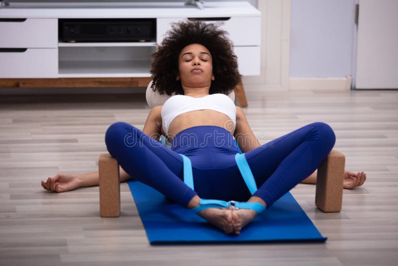 Relaxed Young Woman Doing Exercise stock photography Relaxed Young Woman Doing Exercise stock photography