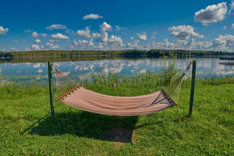 Relaxing Hammock on a Lake Shore Under Summer Sunshine Stock Image Image of idyllic, hammock