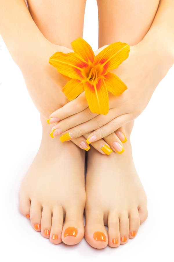 Relaxing pedicure with a orange lily flower