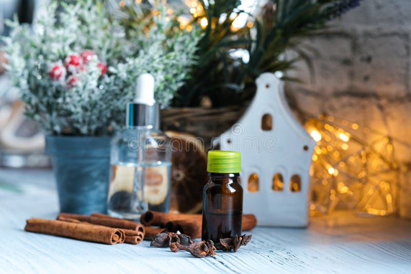 Relaxing Winter Season Essential Oils Blend. Dark Glass Bottles, Cinnamon,  Orange, Pine Twigs, Anise Stock Image - Image of holiday, anise: 158100767