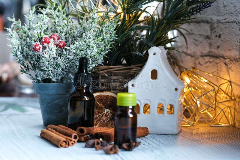 Relaxing Winter Season Essential Oils Blend. Dark Glass Bottles, Cinnamon,  Orange, Pine Twigs, Anise Stock Image - Image of holiday, anise: 158100767