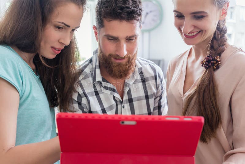 Reliable digital nomads helping their co-worker during remote work stock photos Reliable digital nomads helping their co-worker during remote work stock photos