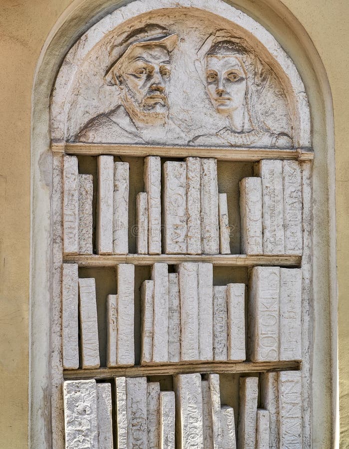 Sculpture In Relief Of A Bookshelf With Books Made Out Of Stone Or