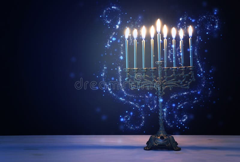 Religion image of jewish holiday Hanukkah background with menorah traditional candelabra and candles