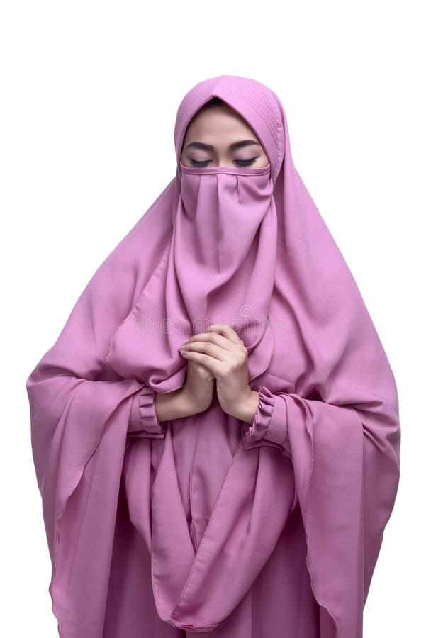 Religious asian muslim woman with niqab dress praying