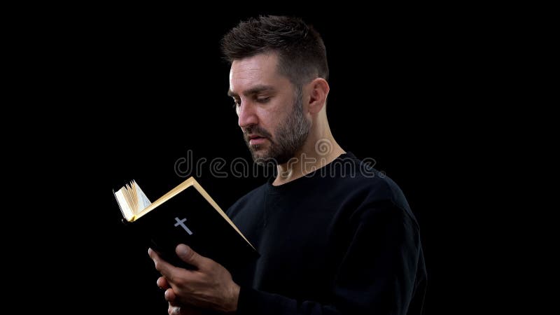 Religious believer holding bible, finding answers to questions, faith in God royalty free stock images